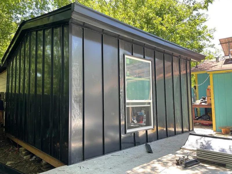 Black standing seam metal wall panels for Roof Inspection in Pilot Point